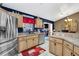 The kitchen features stainless steel appliances and a view of the living room at 4828 Jeanette Ct, St Cloud, FL 34771