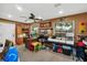 Large, well-lit home office featuring two large windows and a ceiling fan at 4828 Jeanette Ct, St Cloud, FL 34771