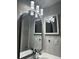 Well-lit bathroom with modern mirror and sconces at 5967 Village Cir # Ge, Orlando, FL 32822