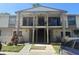 Inviting condo featuring balconies and a staircase leading to the upper levels, offering a blend of comfort and style at 5967 Village Cir # Ge, Orlando, FL 32822