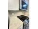 Modern kitchen features stainless steel appliances and granite countertops at 5967 Village Cir # Ge, Orlando, FL 32822