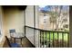 Balcony area with seating offering views of the surrounding community and lush greenery at 6100 Stevenson Dr # 202, Orlando, FL 32835