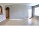 Open living room featuring tile floors, neutral-painted walls, and plenty of space for entertaining guests at 6100 Stevenson Dr # 202, Orlando, FL 32835
