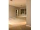 Neutral living room featuring tile floors, neutral-painted walls, and a large window for natural light at 6100 Stevenson Dr # 202, Orlando, FL 32835