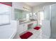 Bathroom featuring double sinks, granite countertop, walk-in shower, and soaking tub at 7912 Golden Pond Cir, Kissimmee, FL 34747