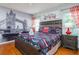 Bedroom featuring a king bed, London themed decor, and hardwood floors at 7912 Golden Pond Cir, Kissimmee, FL 34747