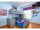Vibrant ' bedroom with a fun Spider-Personal theme, featuring a bunk bed and playful decor at 7912 Golden Pond Cir, Kissimmee, FL 34747