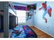 Vibrant ' bedroom with a fun Spider-Personal theme, featuring a bunk bed and playful decor at 7912 Golden Pond Cir, Kissimmee, FL 34747