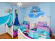 themed bedroom with Frozen mural, hardwood floors, and twin beds at 7912 Golden Pond Cir, Kissimmee, FL 34747
