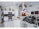 Open-concept kitchen with granite countertops, stainless steel appliances, and bar seating at 7912 Golden Pond Cir, Kissimmee, FL 34747