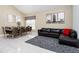 Cozy living room and dining room featuring a comfortable sofa, dining table, and unique decorations at 7912 Golden Pond Cir, Kissimmee, FL 34747