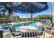 Inviting screened-in pool area with ample seating for entertaining and relaxing at 7912 Golden Pond Cir, Kissimmee, FL 34747