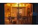 Cozy balcony with charming string lights and comfortable seating for relaxing evenings at 8103 Coconut Palm Way # 203, Kissimmee, FL 34747