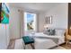 Cozy bedroom with a comfortable bench, side tables, and stylish decor at 8103 Coconut Palm Way # 203, Kissimmee, FL 34747