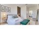 Cozy bedroom with a decorative wall accent and an ensuite bathroom at 8103 Coconut Palm Way # 203, Kissimmee, FL 34747