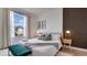 Inviting bedroom with a large window, decorative wall, and comfortable bench at 8103 Coconut Palm Way # 203, Kissimmee, FL 34747