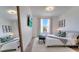 A bright and modern bedroom featuring a television and elegant decor at 8103 Coconut Palm Way # 203, Kissimmee, FL 34747