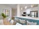 Modern kitchen with a center island, stainless steel appliances, and pendant lighting at 8103 Coconut Palm Way # 203, Kissimmee, FL 34747