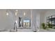 Bright, open kitchen with modern lighting, stainless steel faucet, and white countertops at 8103 Coconut Palm Way # 203, Kissimmee, FL 34747