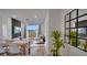 Open concept living room with a dining area, and wall mounted television at 8103 Coconut Palm Way # 203, Kissimmee, FL 34747