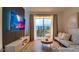 Relaxing living room with a view of the lake and outdoor seating area on the porch at 8103 Coconut Palm Way # 203, Kissimmee, FL 34747
