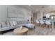 Open concept living room and dining area with modern furnishings and decor at 8103 Coconut Palm Way # 203, Kissimmee, FL 34747