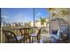 Relaxing screened patio area with comfortable seating and views of manicured grounds at 8103 Coconut Palm Way # 203, Kissimmee, FL 34747