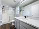 Bathroom with a walk-in shower and modern vanity with white countertop at 838 Sandy Ridge Dr, Davenport, FL 33896