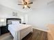 Bedroom featuring a ceiling fan, wood floors, and neutral paint at 838 Sandy Ridge Dr, Davenport, FL 33896