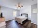 Bedroom featuring a ceiling fan, a window with curtains, and neutral-colored walls at 838 Sandy Ridge Dr, Davenport, FL 33896