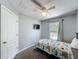 Bedroom with a ceiling fan, neutral walls, and a window view of the screened-in pool area at 838 Sandy Ridge Dr, Davenport, FL 33896