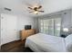 Bedroom showcasing light colored dresser, window, and ceiling fan at 838 Sandy Ridge Dr, Davenport, FL 33896