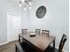 Dining room with modern light fixture and seating for four at 838 Sandy Ridge Dr, Davenport, FL 33896