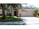 Charming single-story home featuring a two-car garage and well-maintained landscaping at 838 Sandy Ridge Dr, Davenport, FL 33896