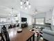 Open floor plan featuring a living room, dining area, and modern kitchen with barstool seating at 838 Sandy Ridge Dr, Davenport, FL 33896