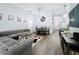 Spacious living area with a dining table, wood flooring, and large windows for ample natural light at 838 Sandy Ridge Dr, Davenport, FL 33896