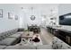 Open-concept living space combining living, dining, and kitchen areas with stylish decor and ample seating at 838 Sandy Ridge Dr, Davenport, FL 33896