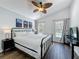 Bedroom with a ceiling fan and windows overlooking the pool at 838 Sandy Ridge Dr, Davenport, FL 33896
