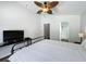 Bedroom with a ceiling fan and ensuite bathroom at 838 Sandy Ridge Dr, Davenport, FL 33896