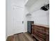 Walk-in closet with wood floors, wooden chest of drawers, and metal shelving at 838 Sandy Ridge Dr, Davenport, FL 33896