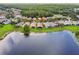Home with screened lanai overlooking lake at 925 Grand Canal Dr, Poinciana, FL 34759
