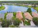 Stunning lakefront homes boasting well-manicured lawns and lush landscaping at 925 Grand Canal Dr, Poinciana, FL 34759