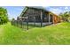 Rear exterior view with large screened in patio at 925 Grand Canal Dr, Poinciana, FL 34759