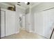 Hallway with multiple closet doors and doorways to other rooms of the home at 925 Grand Canal Dr, Poinciana, FL 34759