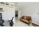 Spacious home office with seating, a large closet, and a desk area perfect for working from home at 925 Grand Canal Dr, Poinciana, FL 34759