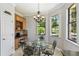 Cozy kitchen nook with views of the landscaped yard at 925 Grand Canal Dr, Poinciana, FL 34759
