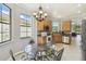 Bright kitchen with stainless steel appliances, wood cabinets, and natural lighting at 925 Grand Canal Dr, Poinciana, FL 34759