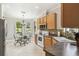 Kitchen nook with stainless steel appliances and a sunlit breakfast area at 925 Grand Canal Dr, Poinciana, FL 34759