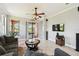 Spacious living room with neutral decor, ceiling fan, and sliding doors to the patio at 925 Grand Canal Dr, Poinciana, FL 34759