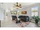 Bright living room with neutral walls, tile flooring, and comfortable seating area at 925 Grand Canal Dr, Poinciana, FL 34759